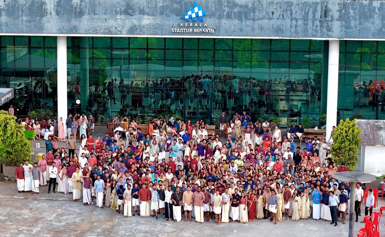 The community gathering for the group photograph.