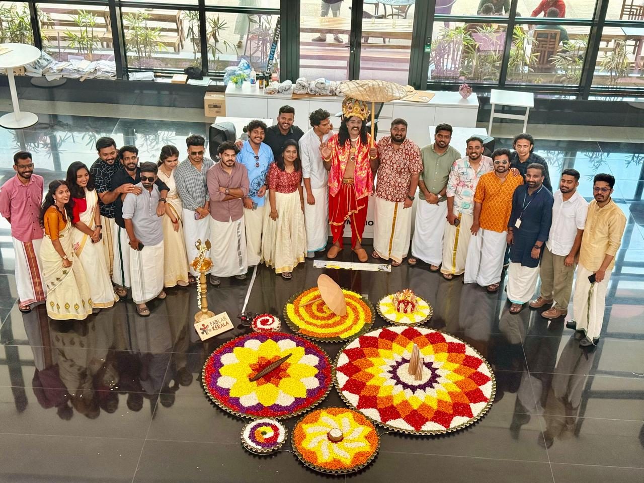 Finished pookalams laid out across the atrium floor.