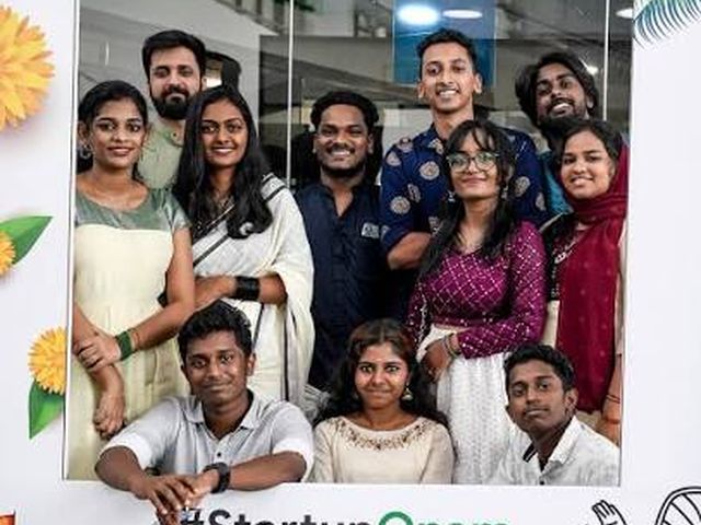 Startup founders and teams posing at the StartupOnam Festival photo frame